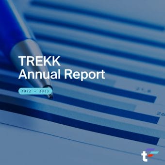 Pen sits over top graphed report. Text over image reads: "TREKK Annual Report. 2022-2023."