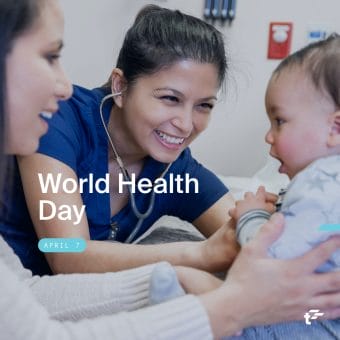 Healthcare worker holds a stethoscope to baby's chest while another adult holds the baby still on the table. Text over image reads: "World Health Day. April 7."