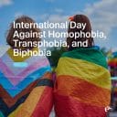 Two youth stand together, wrapped in pride flags. Text over image: "International Day Against Homophobia, Transphobia, and Biphobia. May 17."