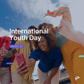 Group of youths smile together, taking a selfie. Text reads: "International Youth Day. August 12."